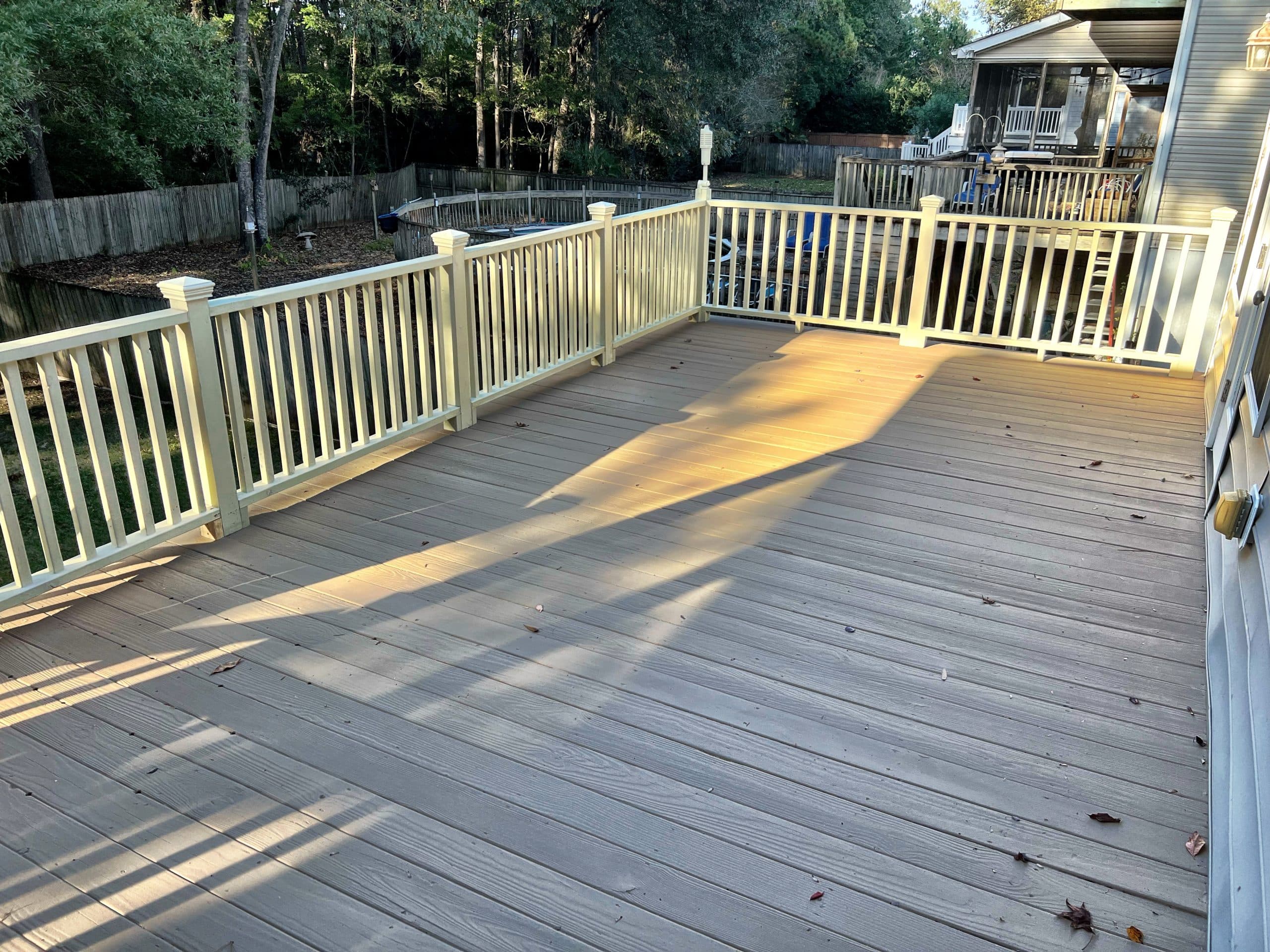 Refinished wood deck overlooking the water at golden hour